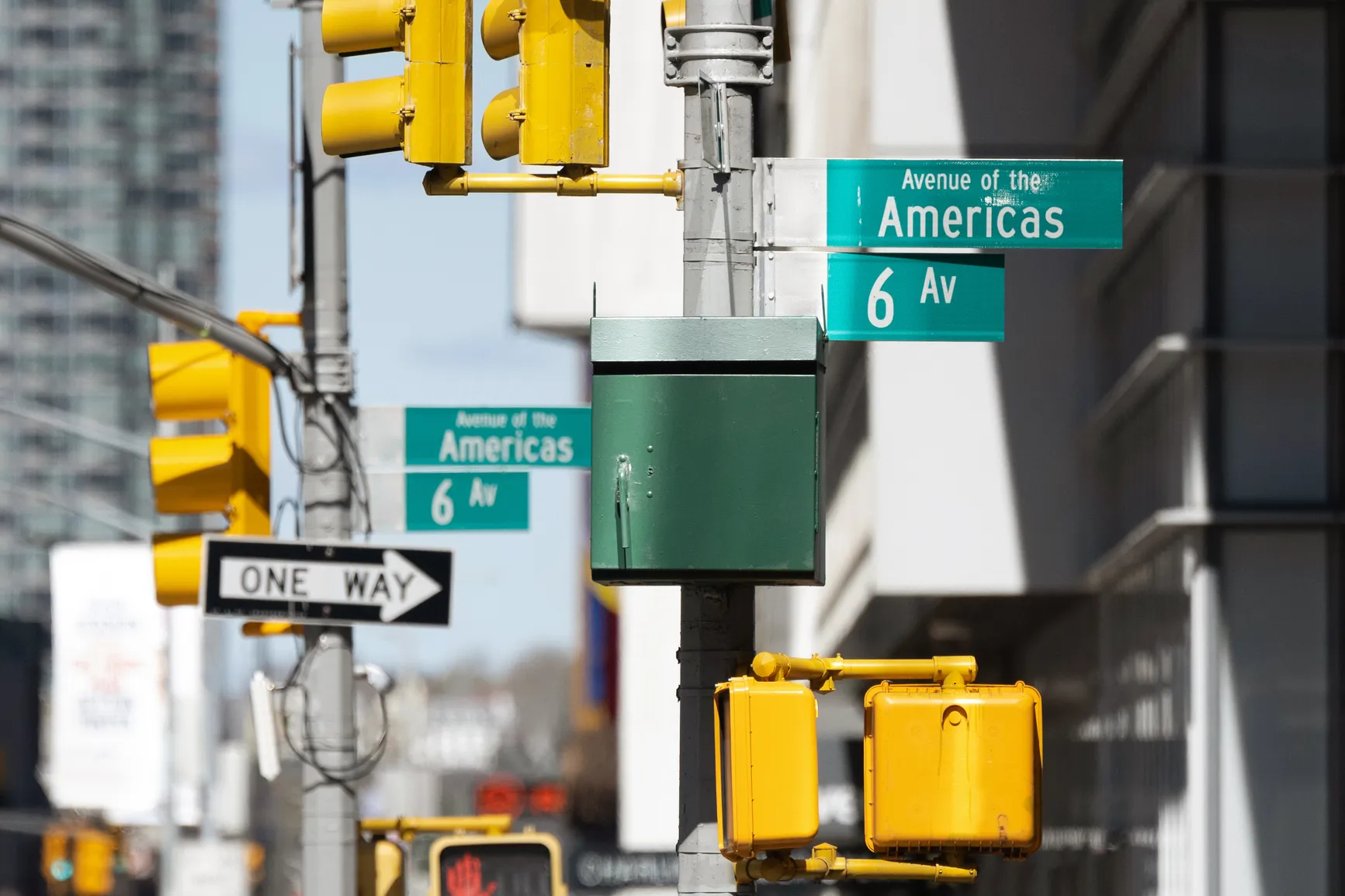 On a New York City street, the signs show the number 6 repeatedly, an example of seeing angel number 666 in daily life.