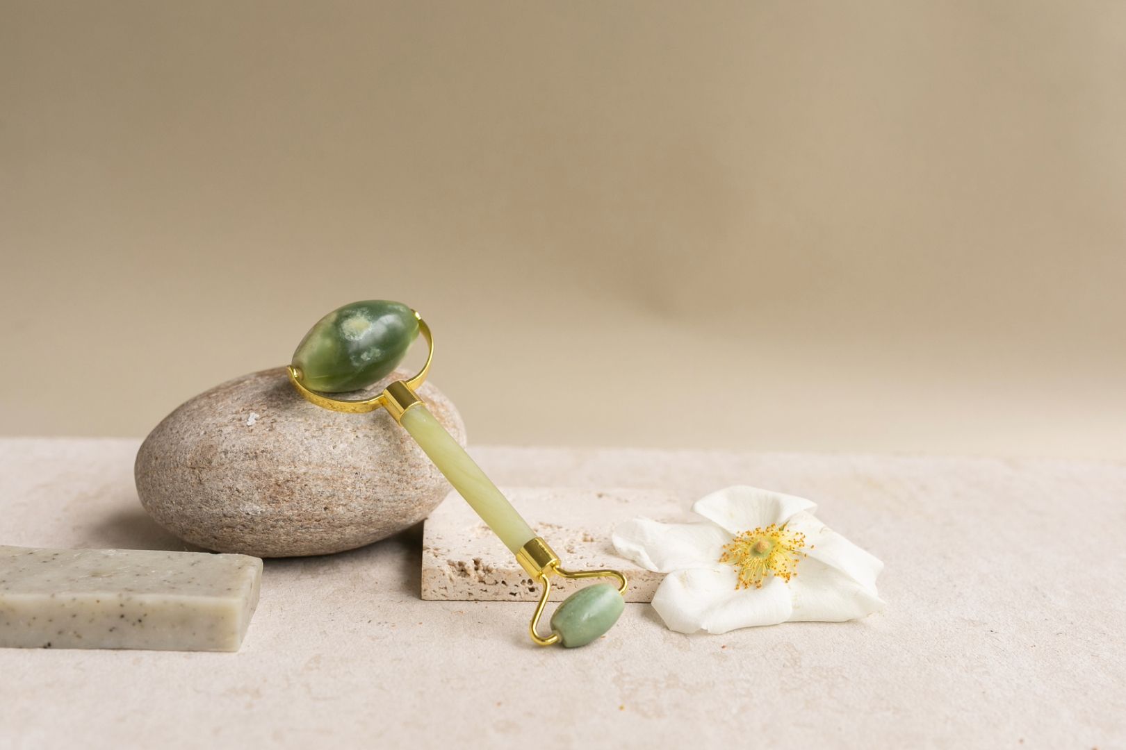 Close-up of facial beauty tool made from green jade