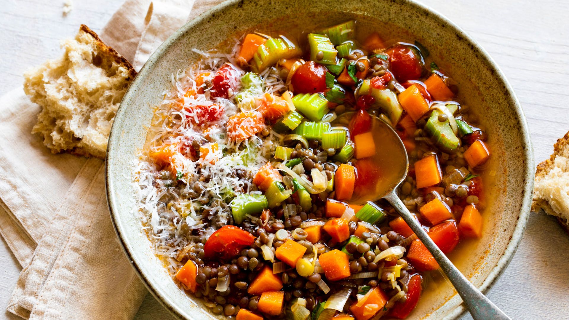 A bowl of plant-protein-packed lentil soup with vegetables 