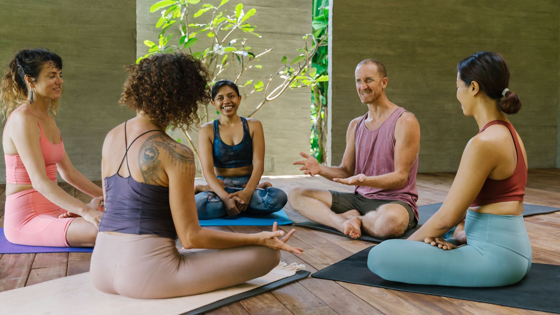 Participants in a group yoga class at a wellness retreat