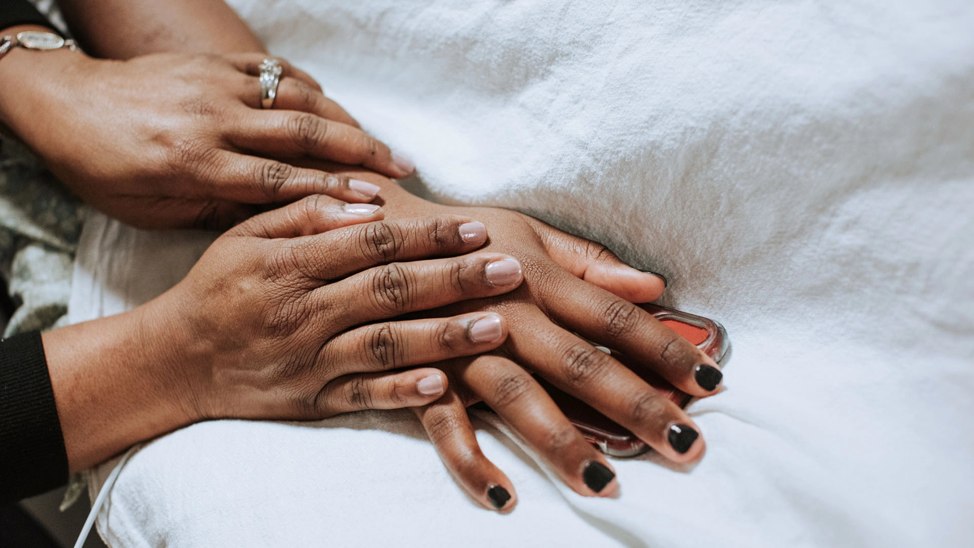 Death doula comforting sick person before passing